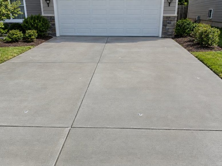 Sunken concrete slab lifted and leveled with polyurethane foam