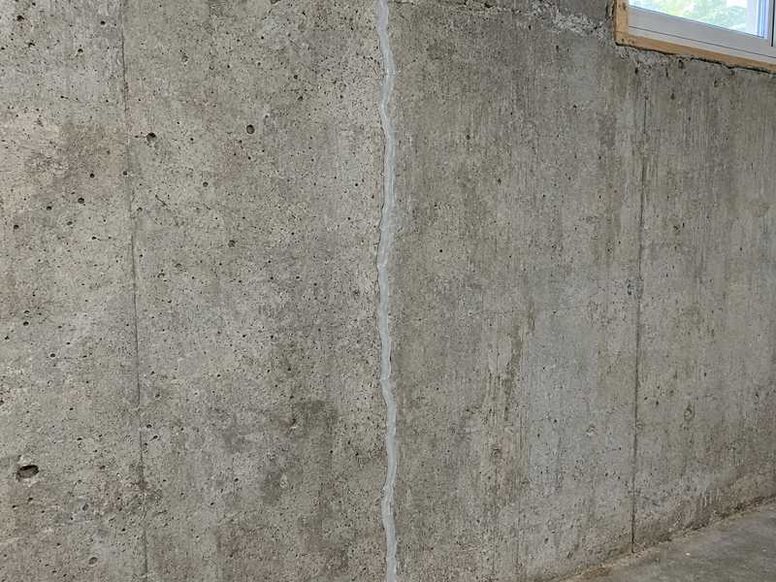 Foundation wall crack sealed with injection in a Charlotte home